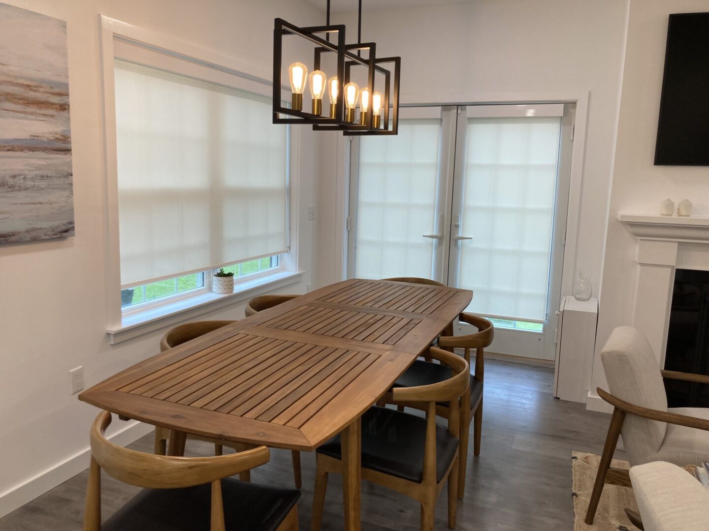 Dining room with wooden table and chairs.